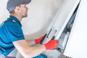 Man working on the Heating System - Lyons AC & Heating, Livingston, TX